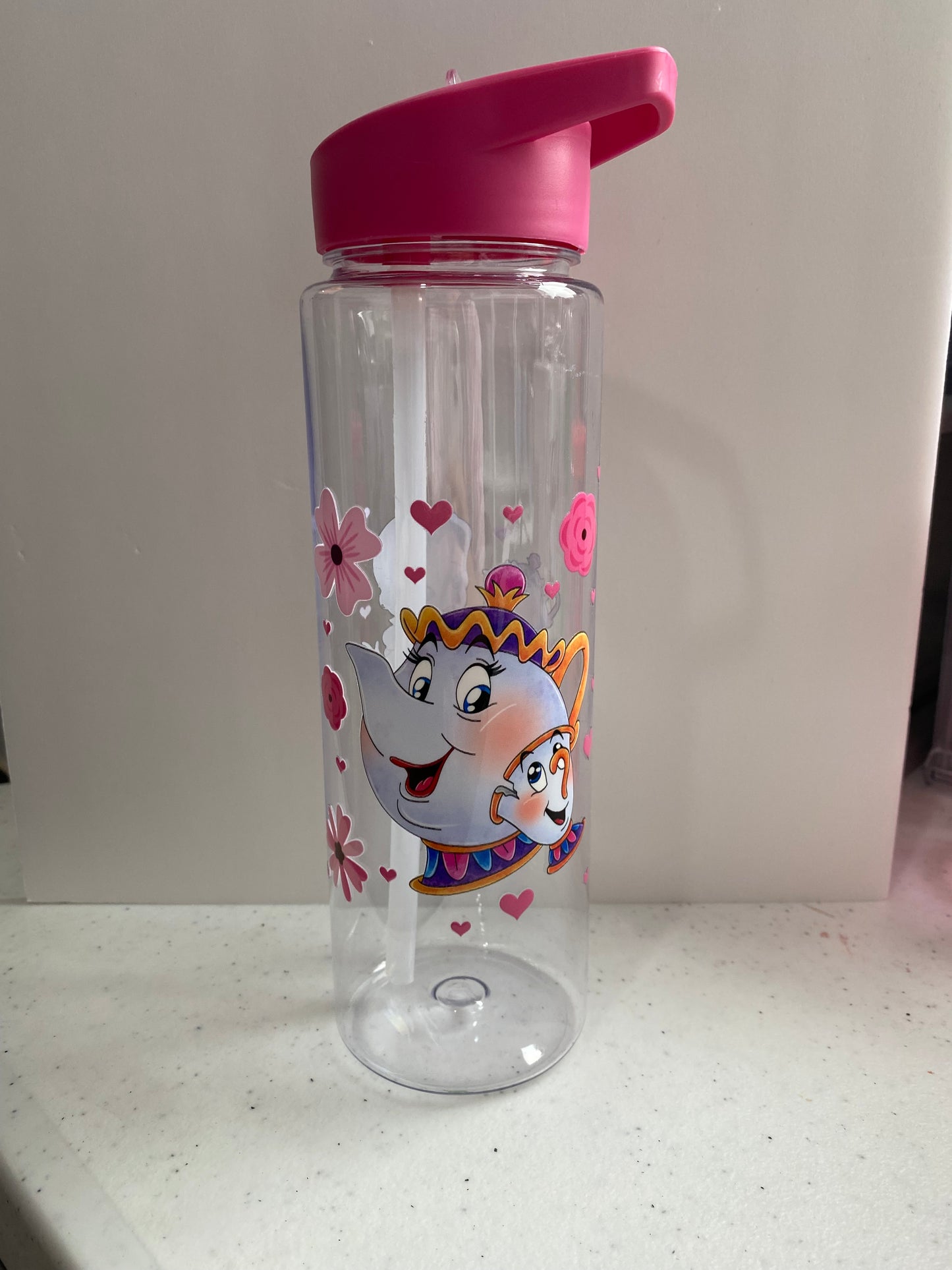 Plastic water bottle with straw