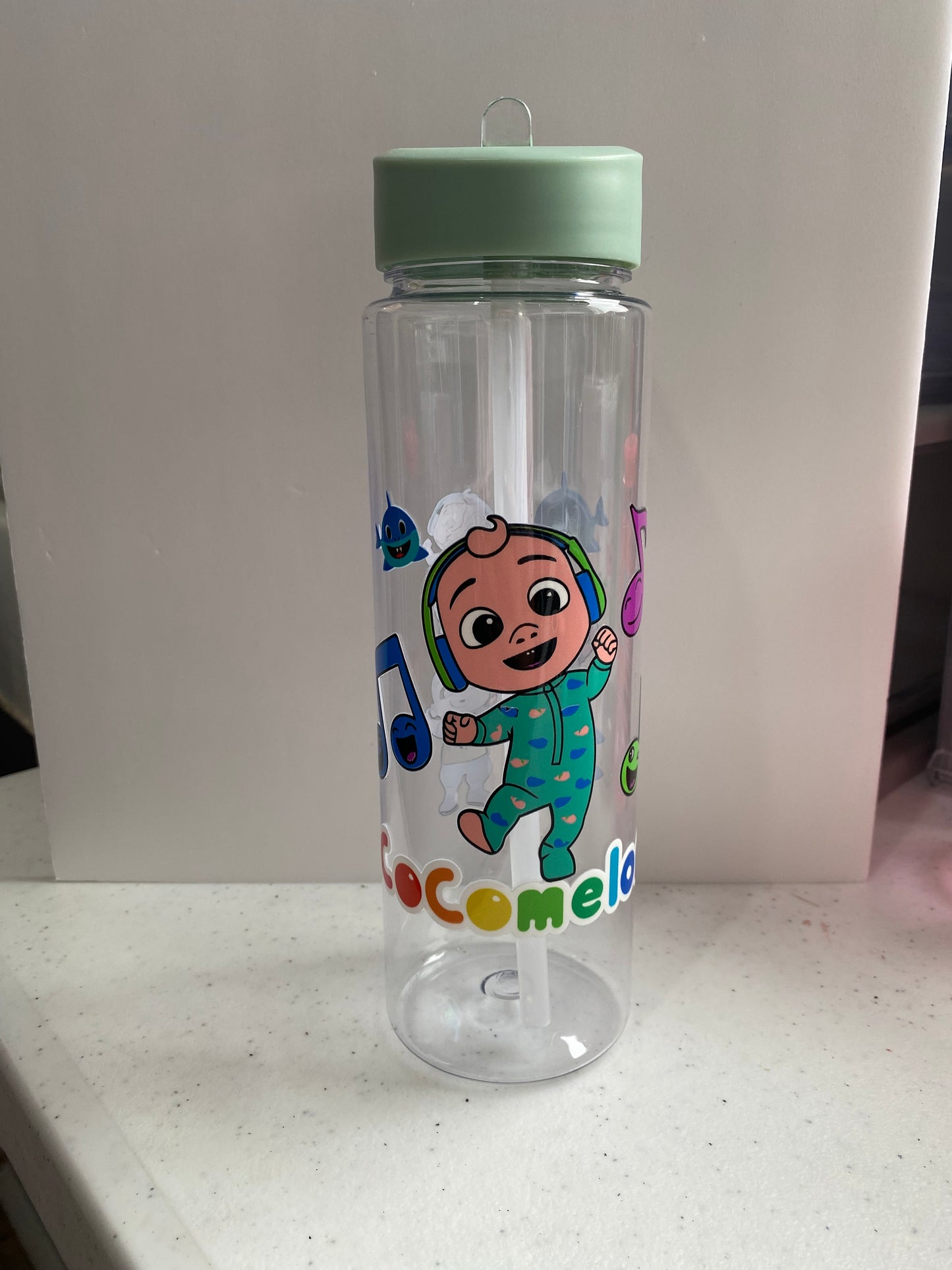 Plastic water bottle with straw