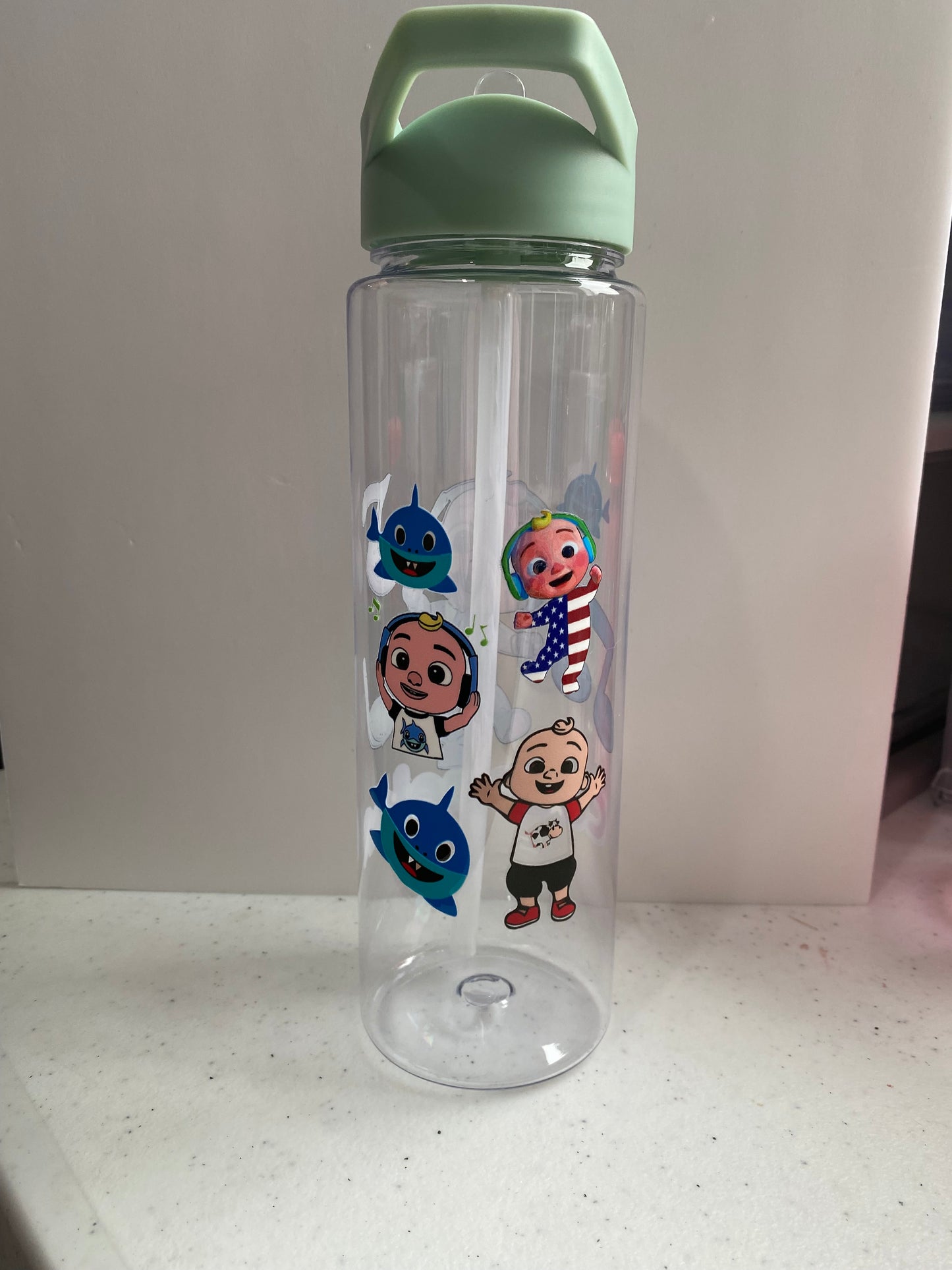 Plastic water bottle with straw